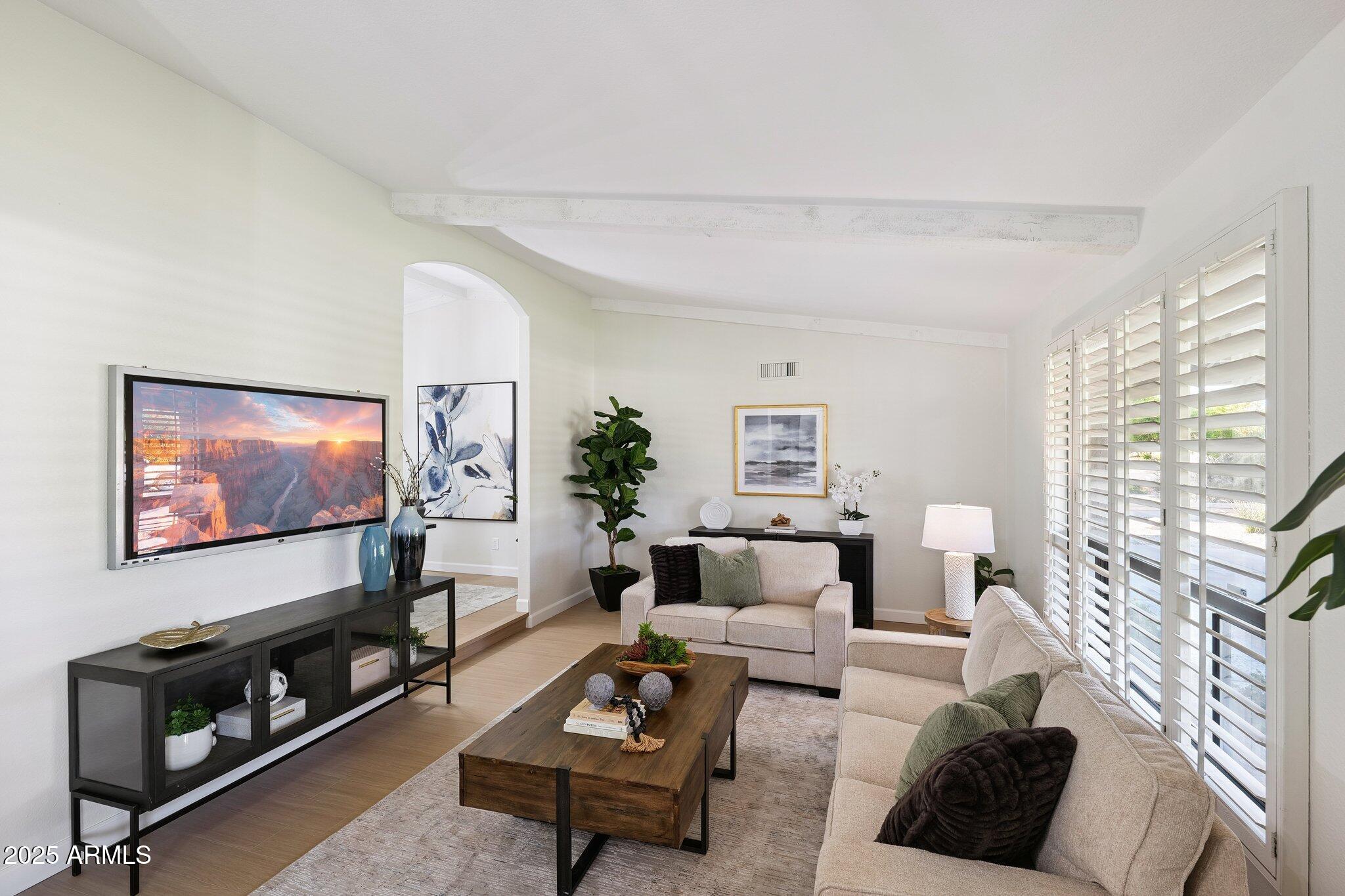 15 East Kathleen Road Phoenix, AZ 85022 - Photo 4 of 40 a living room with furniture and a flat screen tv