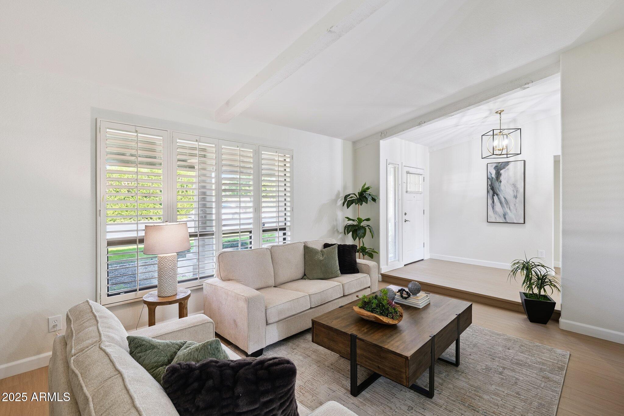15 East Kathleen Road Phoenix, AZ 85022 - Photo 5 of 40 a living room with furniture and a potted plant on a table