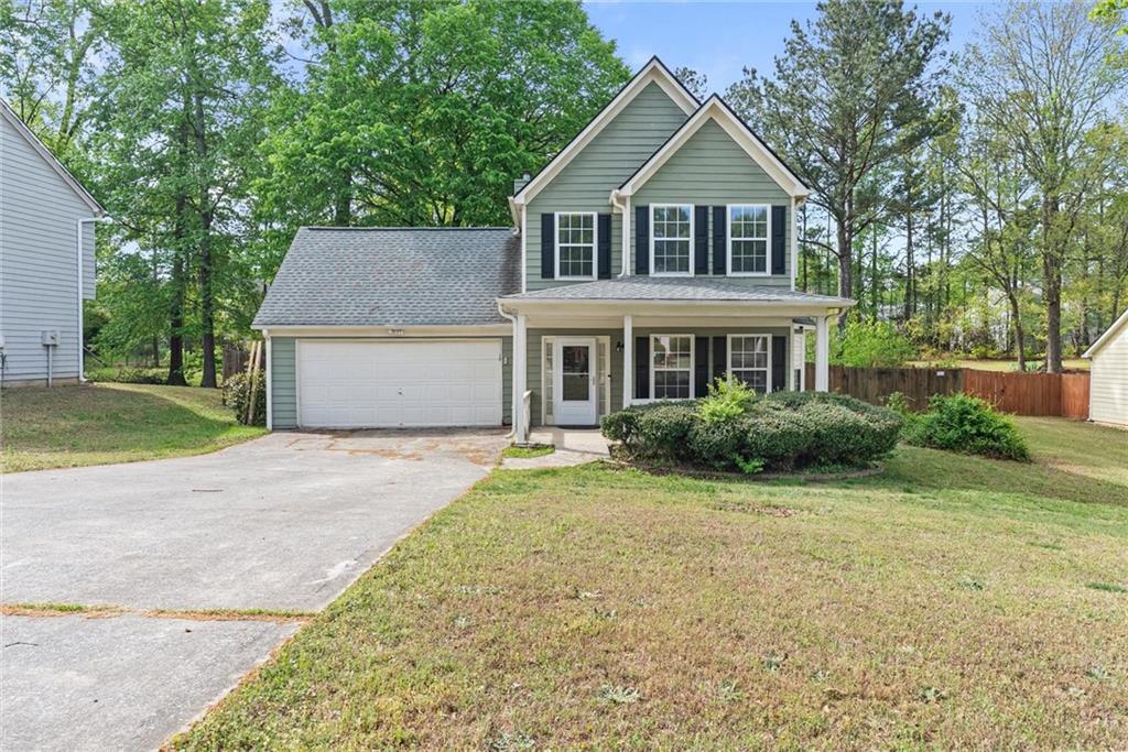 3003 Brass Drive Austell, GA 30106 - Photo 1 of 26 a front view of a house with a garden