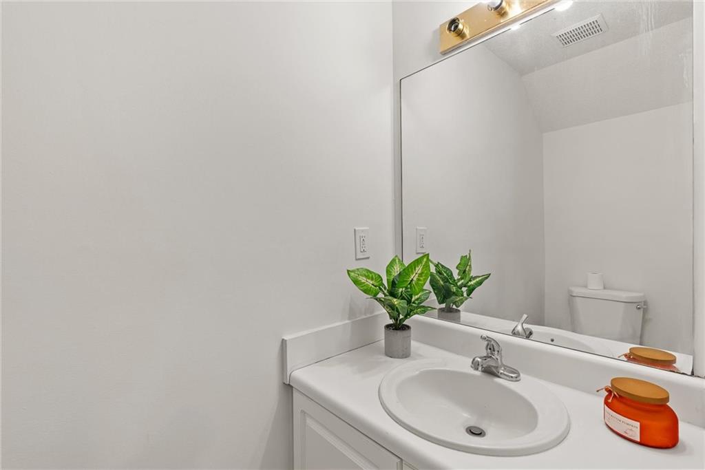 3003 Brass Drive Austell, GA 30106 - Photo 16 of 26 a bathroom with a sink and a mirror