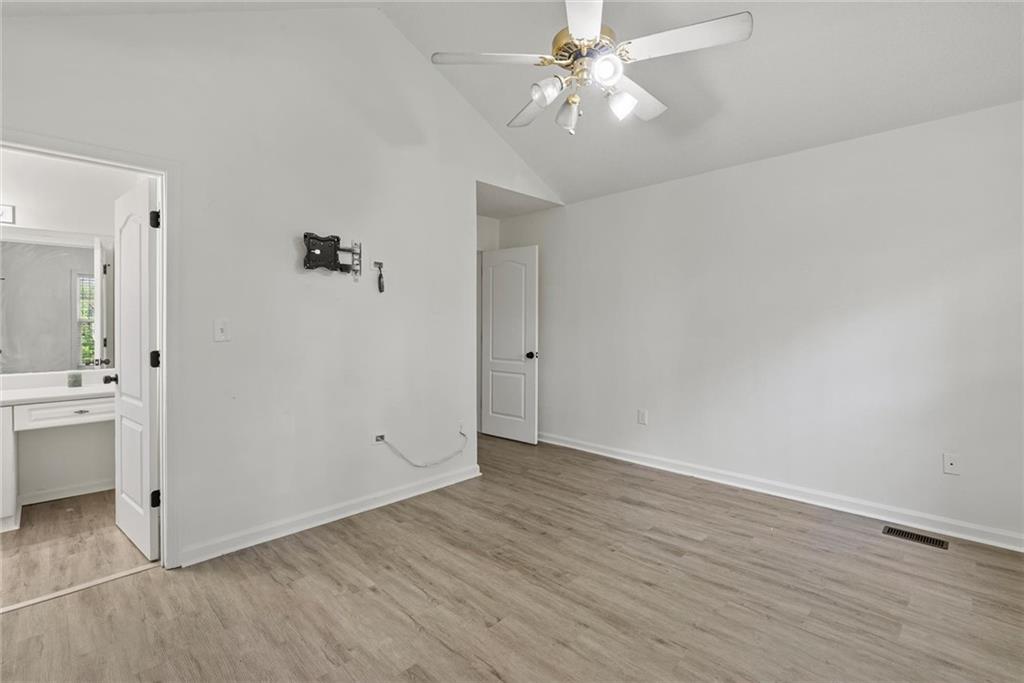 3003 Brass Drive Austell, GA 30106 - Photo 17 of 26 wooden floor in an empty room with a window