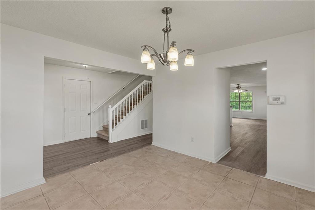 3003 Brass Drive Austell, GA 30106 - Photo 5 of 26 en view interior of a house with stairs and a chandelier