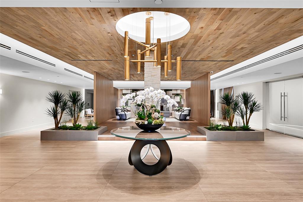 2301 Collins Avenue, Unit 323 Miami Beach, FL 33139 - Photo 20 of 33 a view of a lobby with furniture and chandelier