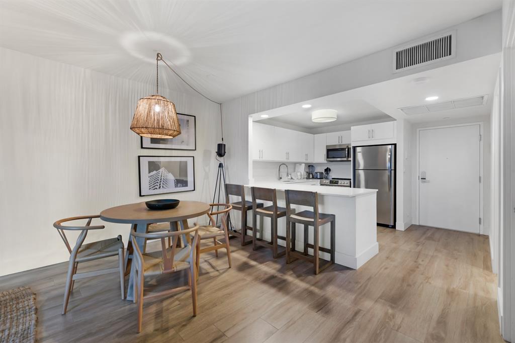2301 Collins Avenue, Unit 323 Miami Beach, FL 33139 - Photo 6 of 33 a view of kitchen with sink and microwave