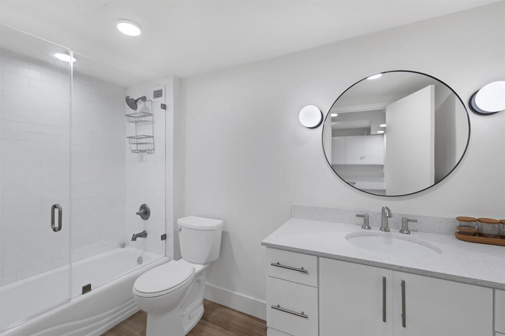 2301 Collins Avenue, Unit 323 Miami Beach, FL 33139 - Photo 7 of 33 a bathroom with a sink a toilet and a mirror