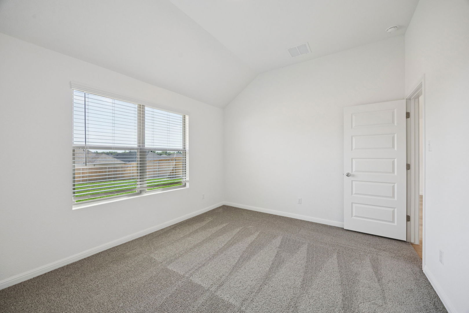 332 Bendecido Loop Elgin, TX 78621 - Photo 24 of 39 an empty room with a window