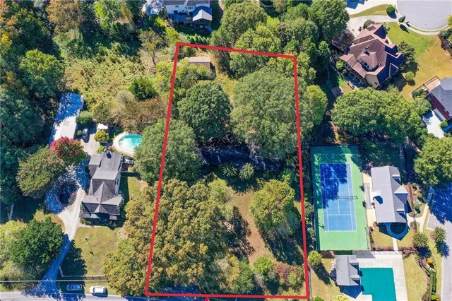 a swimming pool with outdoor seating and yard