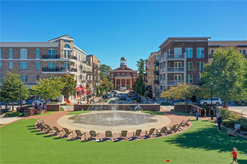 1395 Mid Broadwell Road Alpharetta, GA 30004 - Photo 14 of 67 a swimming pool with outdoor seating and yard