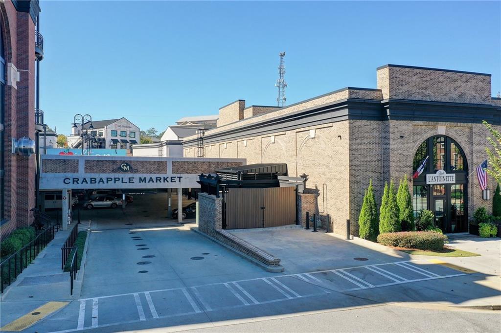 1395 Mid Broadwell Road Alpharetta, GA 30004 - Photo 39 of 67 a view of a patio with table and chairs with wooden floor and fence