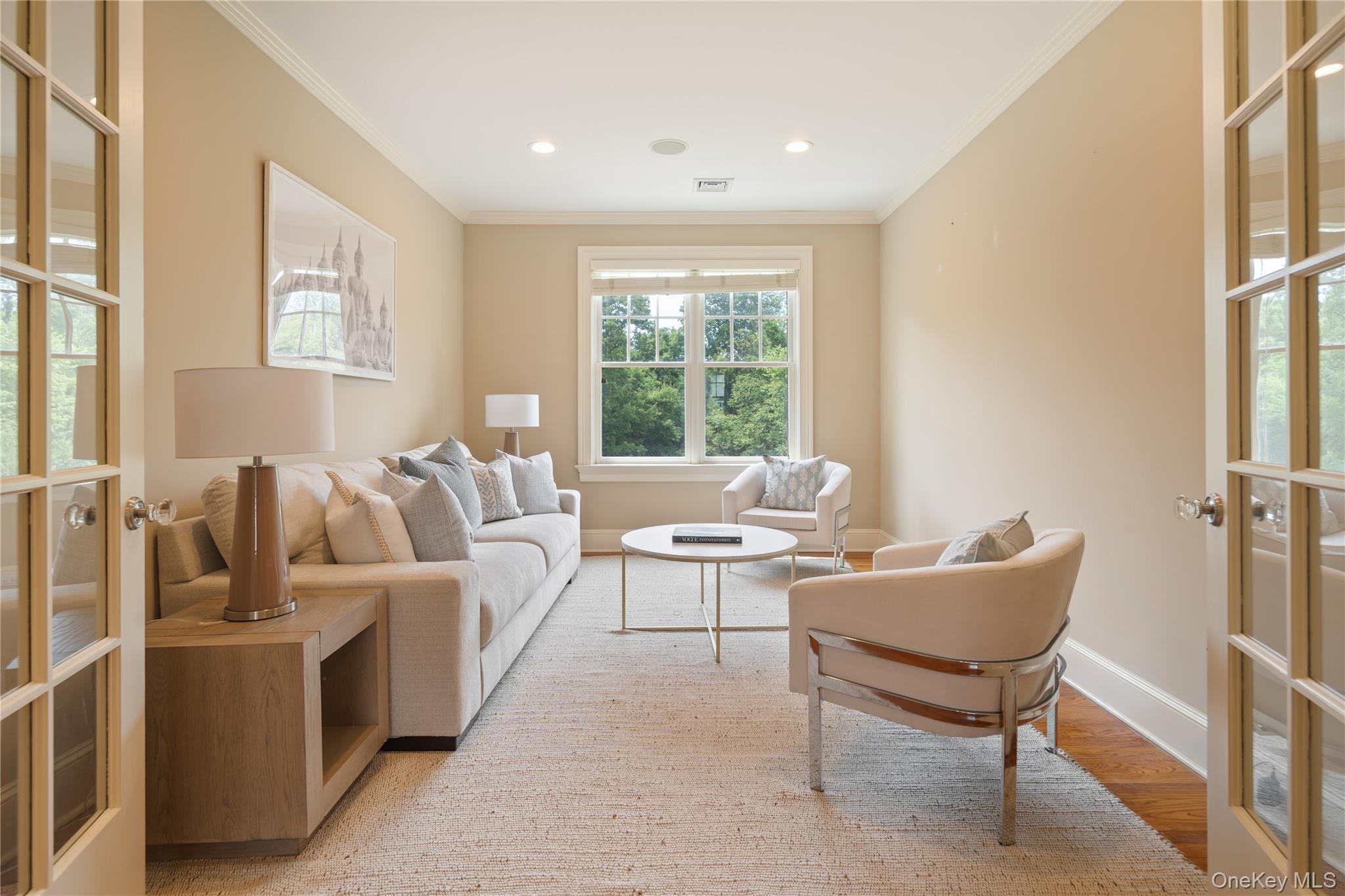 77 Byram Ridge Road Armonk, NY 10504 - Photo 31 of 48 French doors to sitting room/home office directly off of primary bedroom, crown molding, recessed lighting, oak floors