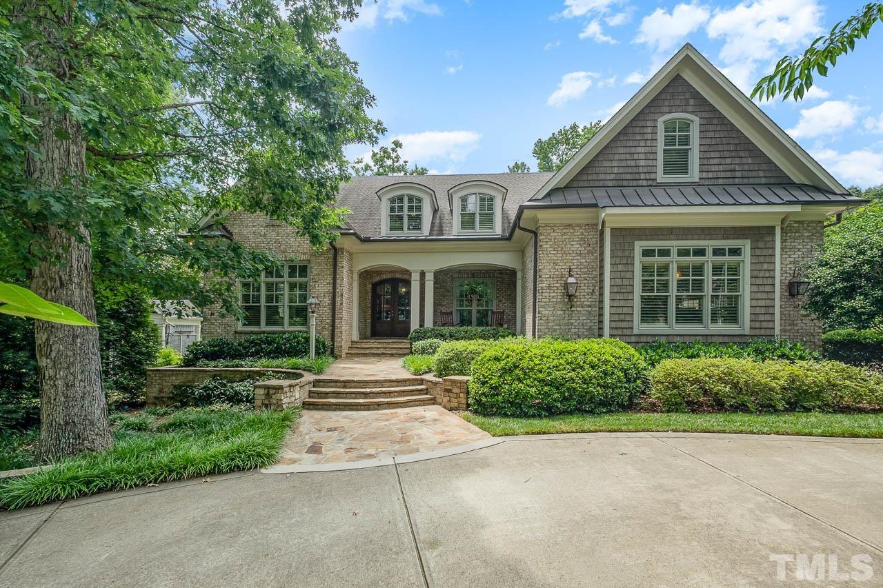 2129 Buckingham Road Raleigh, NC 27607 - Photo 1 of 52 a front view of a house with a yard and potted plants