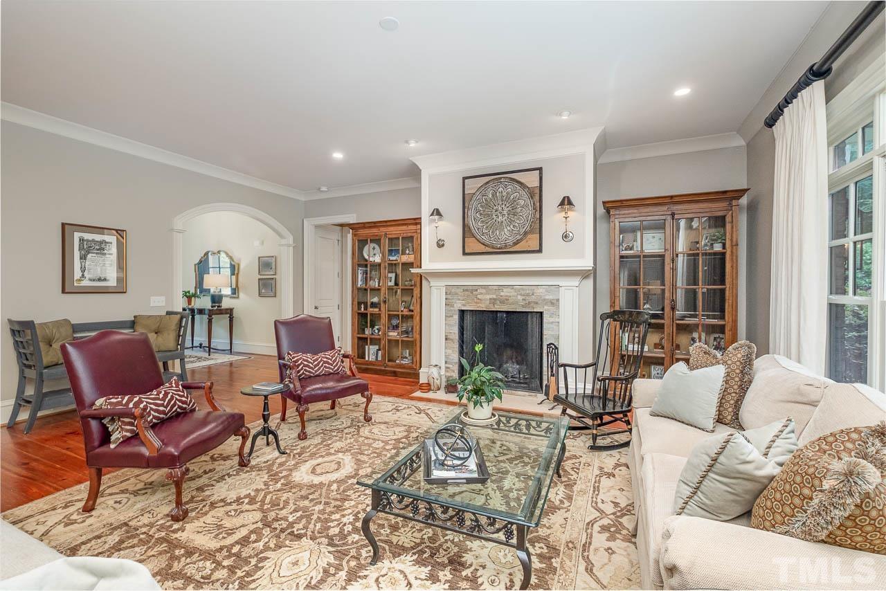 2129 Buckingham Road Raleigh, NC 27607 - Photo 14 of 52 a living room with furniture and a fireplace