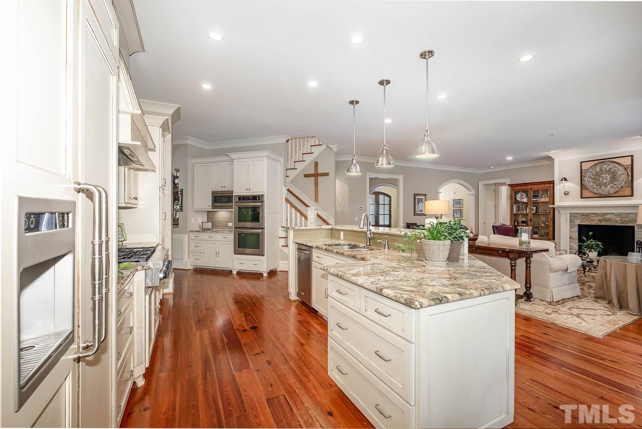 2129 Buckingham Road Raleigh, NC 27607 - Photo 18 of 52 a view of kitchen with cabinets and wooden floor