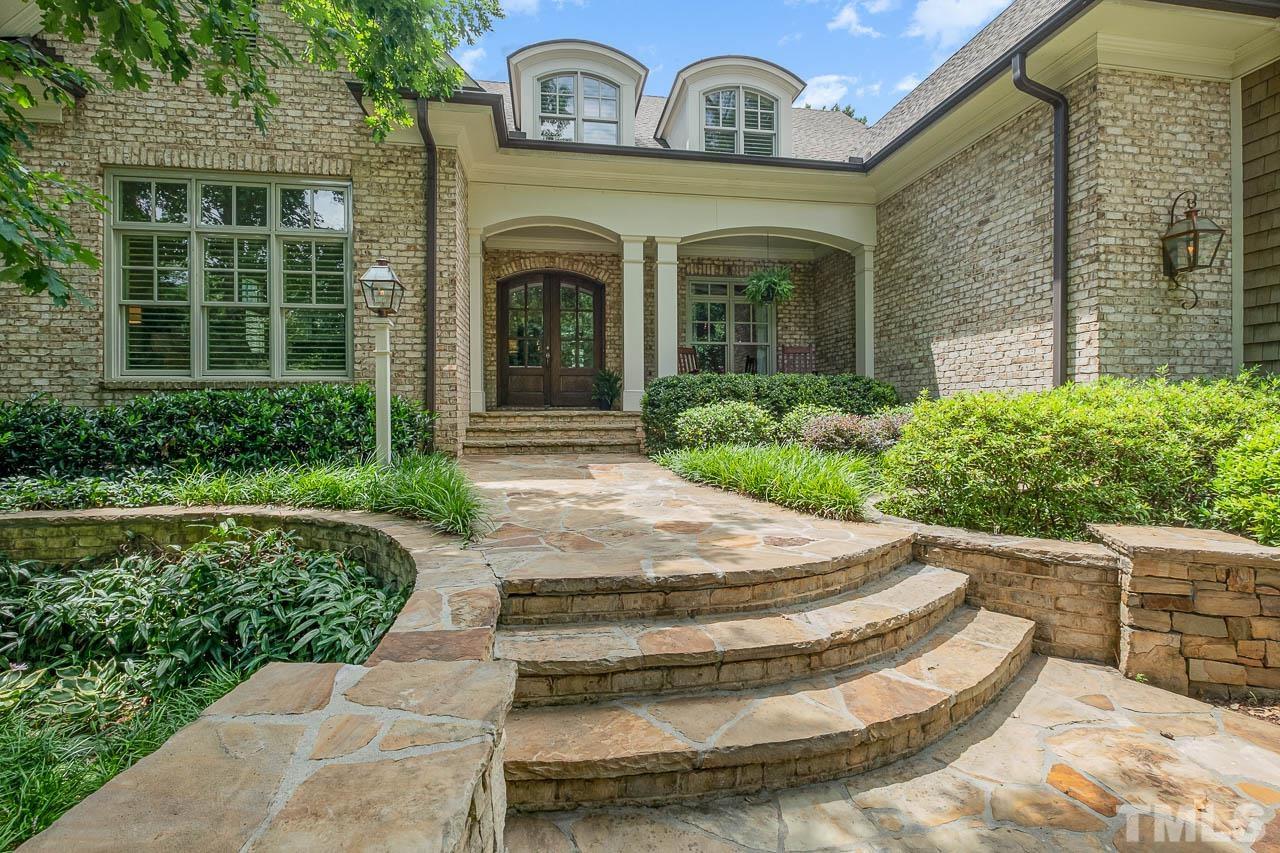2129 Buckingham Road Raleigh, NC 27607 - Photo 2 of 52 a front view of a house with garden