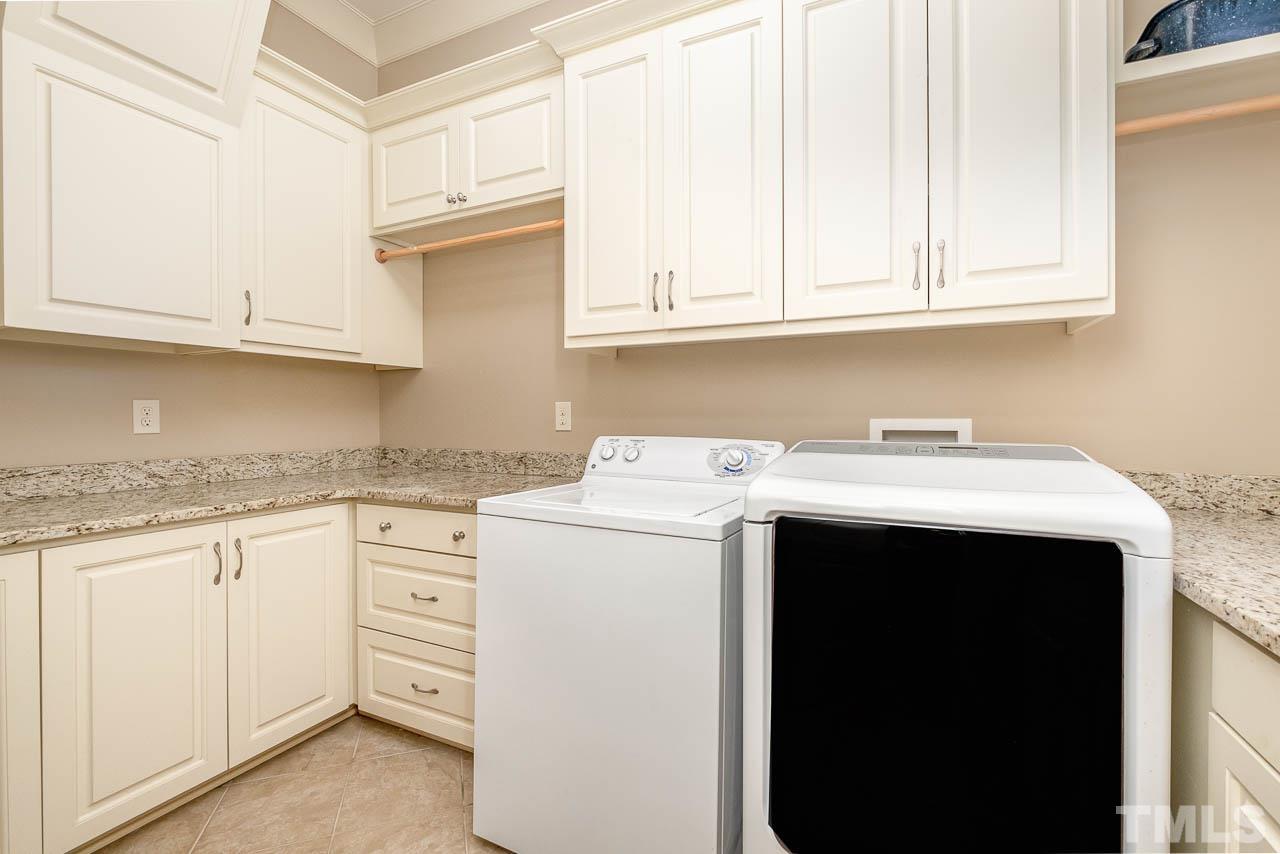 2129 Buckingham Road Raleigh, NC 27607 - Photo 25 of 52 a kitchen with sink and cabinets