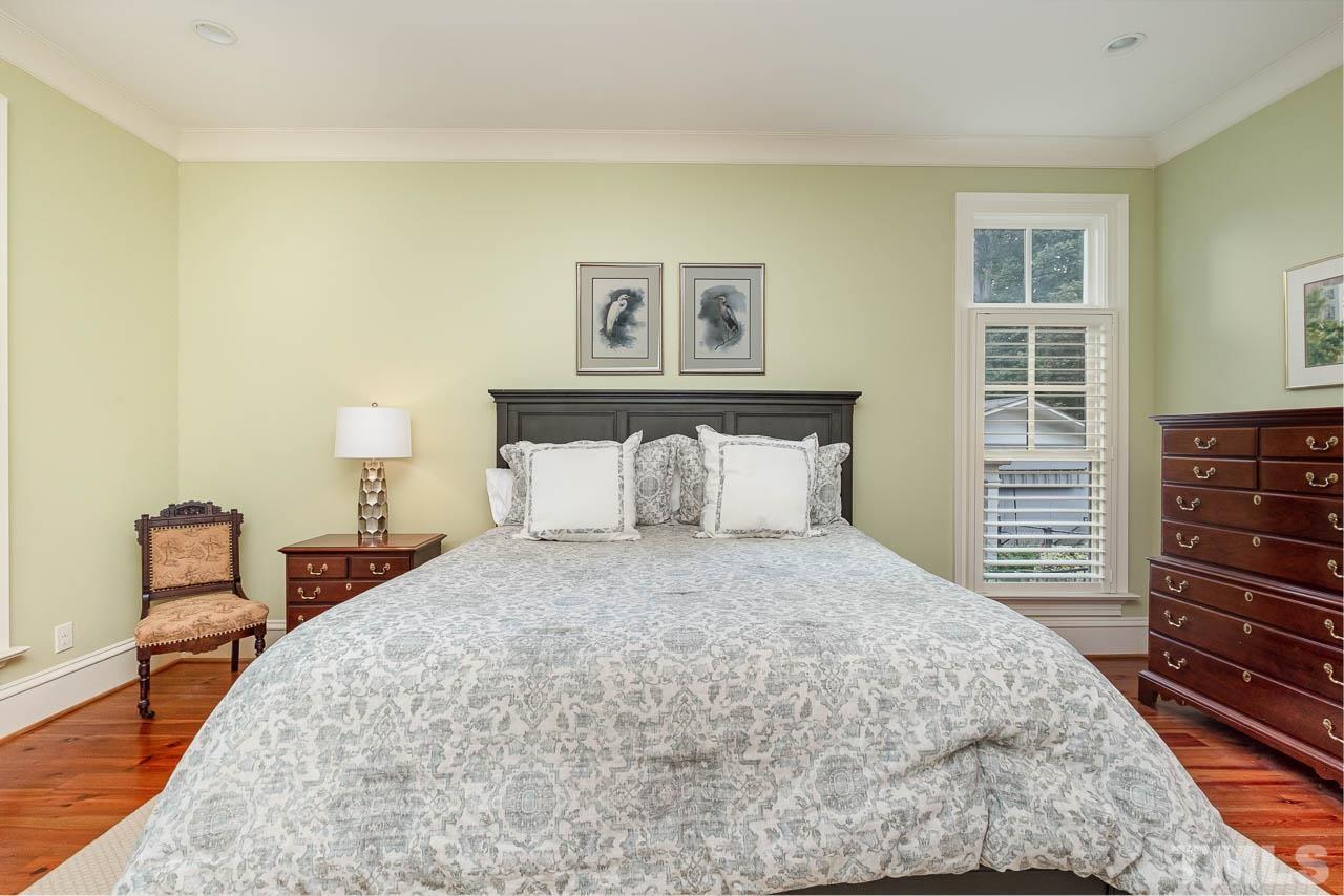 2129 Buckingham Road Raleigh, NC 27607 - Photo 30 of 52 a bedroom with a bed and a closet