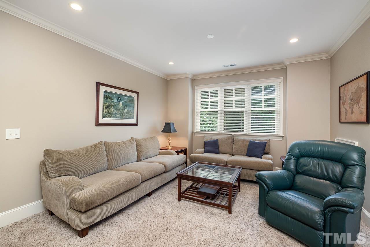 2129 Buckingham Road Raleigh, NC 27607 - Photo 34 of 52 a living room with furniture and a large window