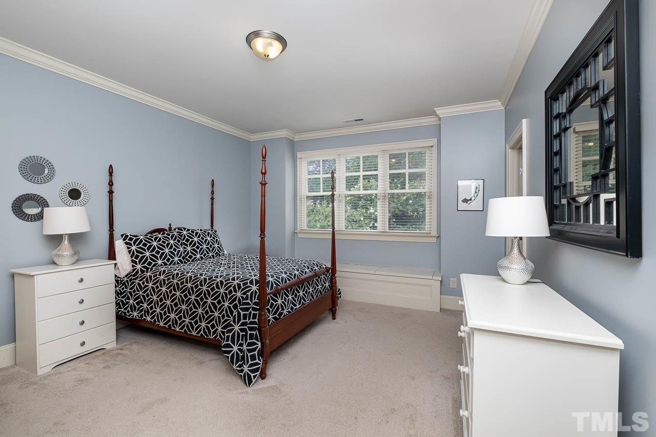 2129 Buckingham Road Raleigh, NC 27607 - Photo 38 of 52 a bed room with a bed and a window