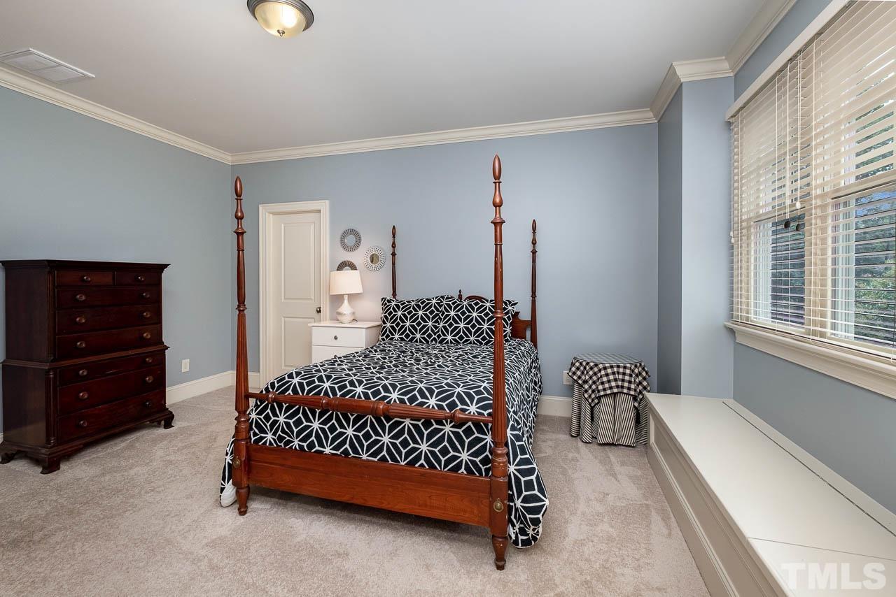 2129 Buckingham Road Raleigh, NC 27607 - Photo 39 of 52 a bedroom with a bed and a window