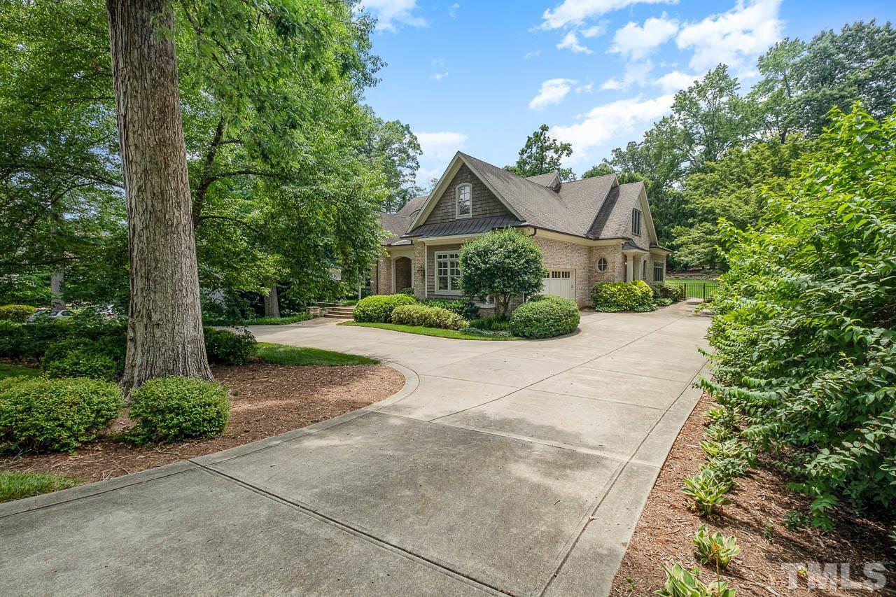 2129 Buckingham Road Raleigh, NC 27607 - Photo 5 of 52 front view of a house with a street