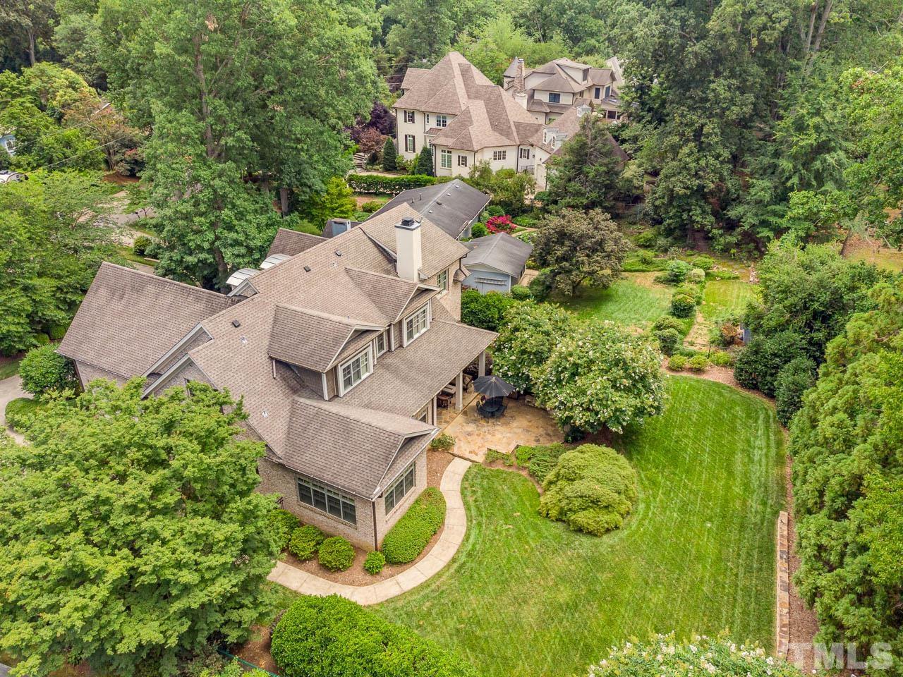 2129 Buckingham Road Raleigh, NC 27607 - Photo 52 of 52 an aerial view of a house with yard and swimming pool