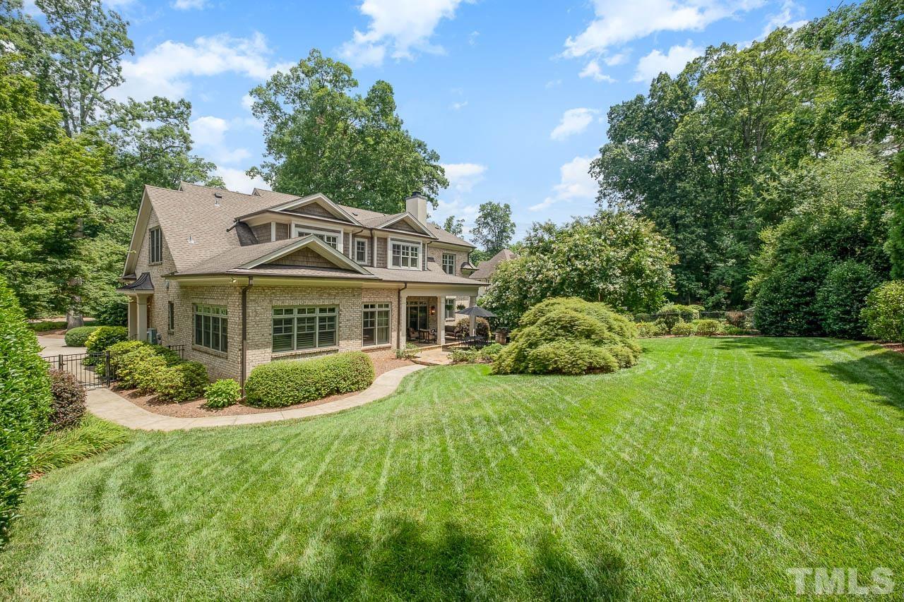 2129 Buckingham Road Raleigh, NC 27607 - Photo 7 of 52 a front view of a house with a yard