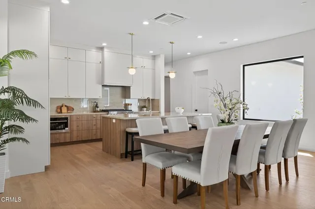 a bedroom with a bed and glass window