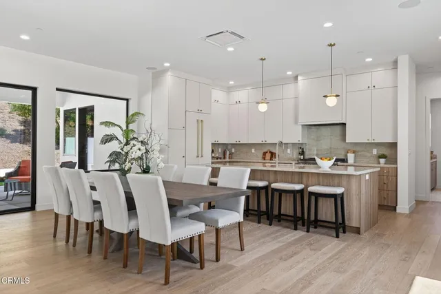 a spacious bedroom with a bed and a flat screen tv