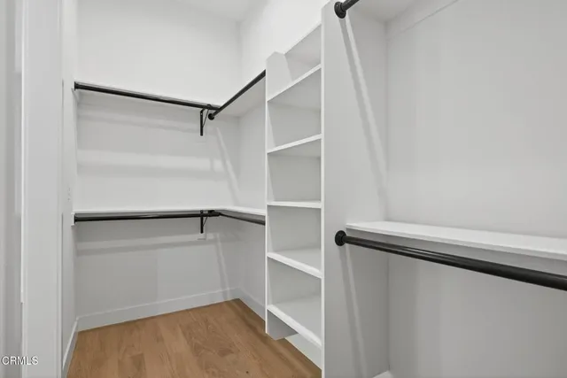 a view of a floor to ceiling window and chair in the patio