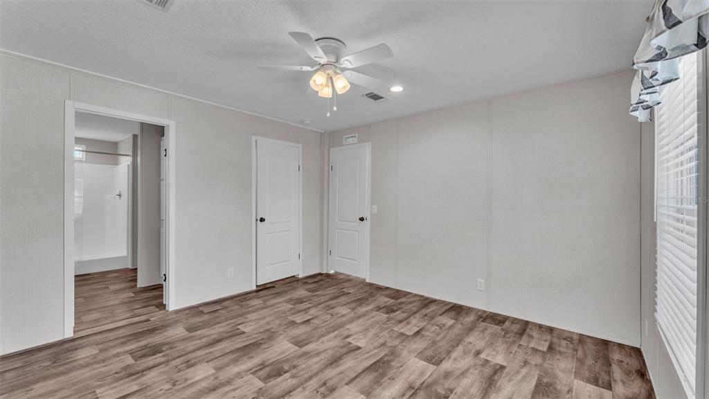 5535 Lake Buffum Road Lake Wales, FL 33859 - Photo 15 of 48 wooden floor in an empty room with a window