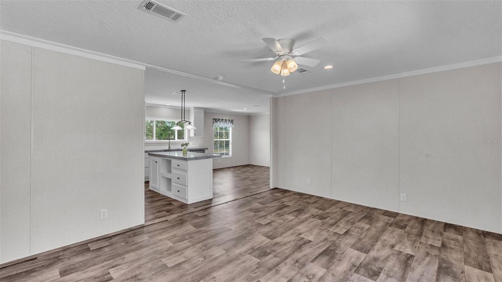 5535 Lake Buffum Road Lake Wales, FL 33859 - Photo 19 of 48 wooden floor in an empty room with a window