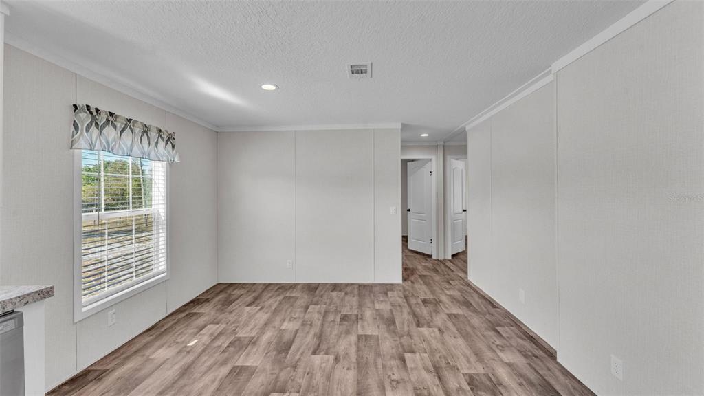 5535 Lake Buffum Road Lake Wales, FL 33859 - Photo 20 of 48 a view of an empty room with wooden floor and a window