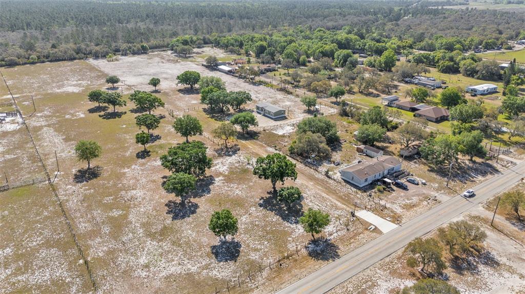 5535 Lake Buffum Road Lake Wales, FL 33859 - Photo 2 of 48 a view of a wooden floor with a lake
