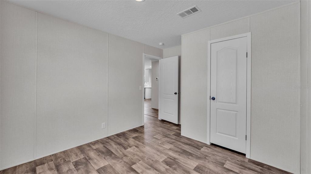 5535 Lake Buffum Road Lake Wales, FL 33859 - Photo 22 of 48 a view of an empty room and wooden floor