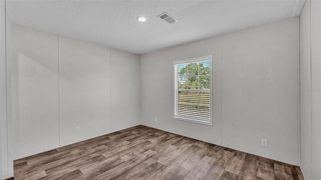 5535 Lake Buffum Road Lake Wales, FL 33859 - Photo 29 of 48 a view of empty room with wooden floor