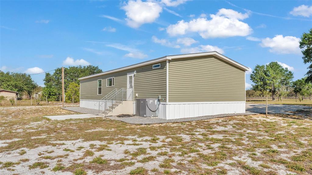 5535 Lake Buffum Road Lake Wales, FL 33859 - Photo 34 of 48 a view of a house with a yard