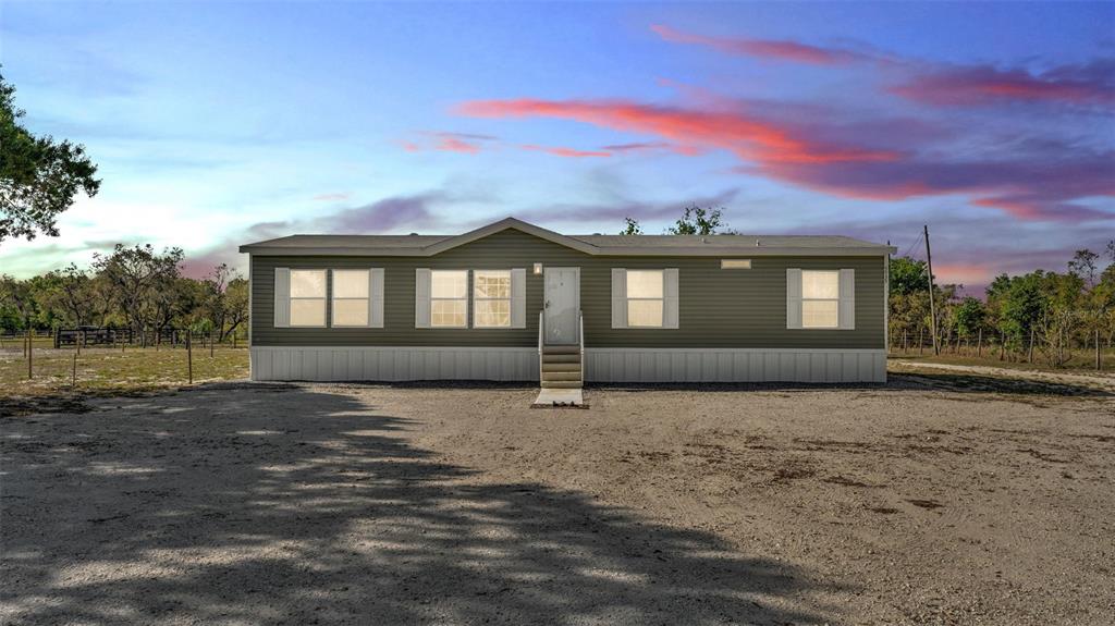 5535 Lake Buffum Road Lake Wales, FL 33859 - Photo 48 of 48 a front view of a house with a yard