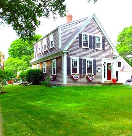 259 First Parish Road Scituate, MA 02066 - Photo 1 of 29 a front view of a house with a garden