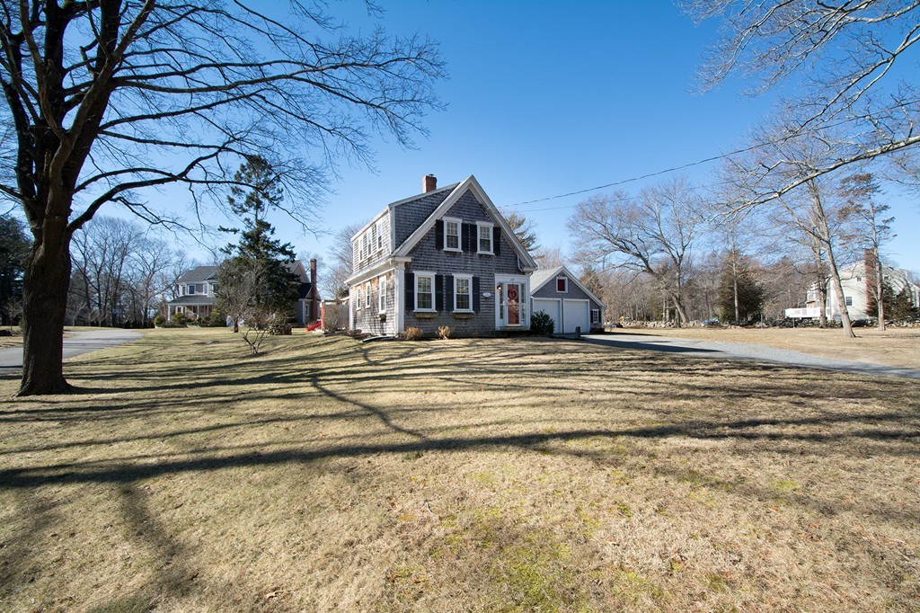 259 First Parish Road Scituate, MA 02066 - Photo 24 of 29 a front view of a house with a yard