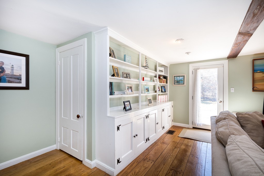 259 First Parish Road Scituate, MA 02066 - Photo 4 of 29 a living room with furniture and a wooden floor