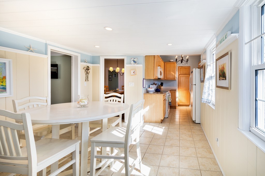 259 First Parish Road Scituate, MA 02066 - Photo 6 of 29 a view of a kitchen with furniture and refrigerator