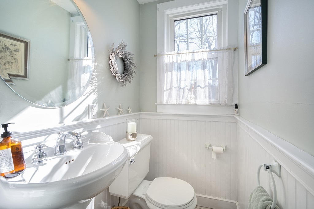 259 First Parish Road Scituate, MA 02066 - Photo 9 of 29 a bathroom with a sink a toilet and a tub