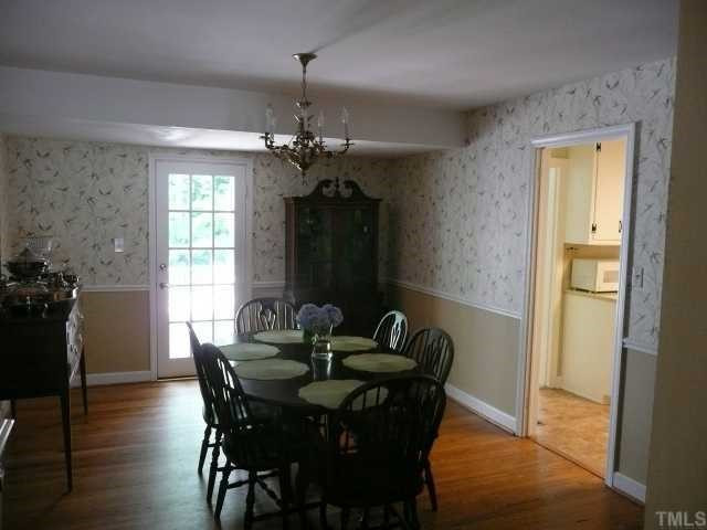 The large dining room with french door to deck helps fill the house with light during the day, but provides a more intimate setting for evening parties.