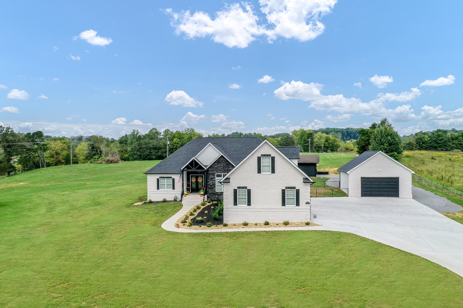 4833 Morganton Road Greenback, TN 37742 - Photo 1 of 40 a front view of a house with garden