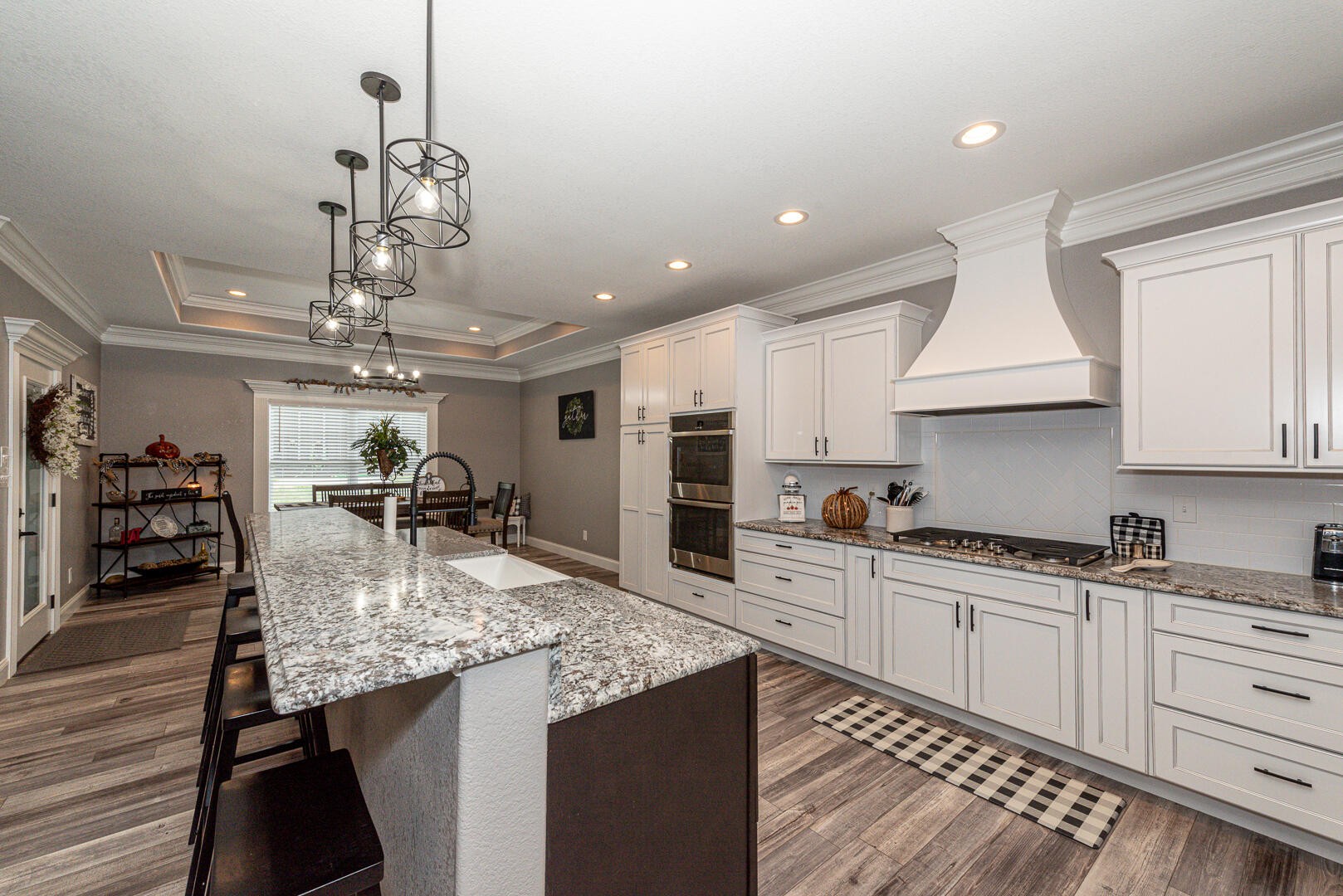 4833 Morganton Road Greenback, TN 37742 - Photo 14 of 40 a kitchen with stainless steel appliances granite countertop a sink dishwasher and refrigerator with wooden floor