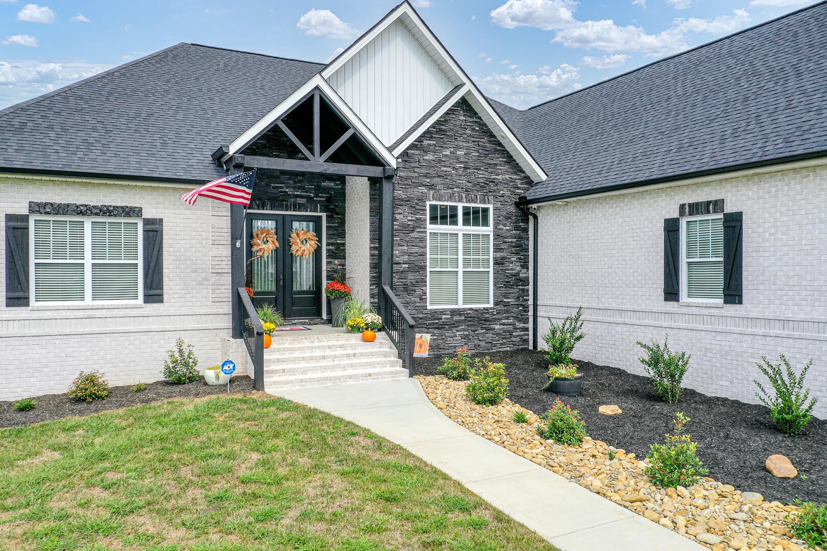 4833 Morganton Road Greenback, TN 37742 - Photo 3 of 40 a front view of a house with garden