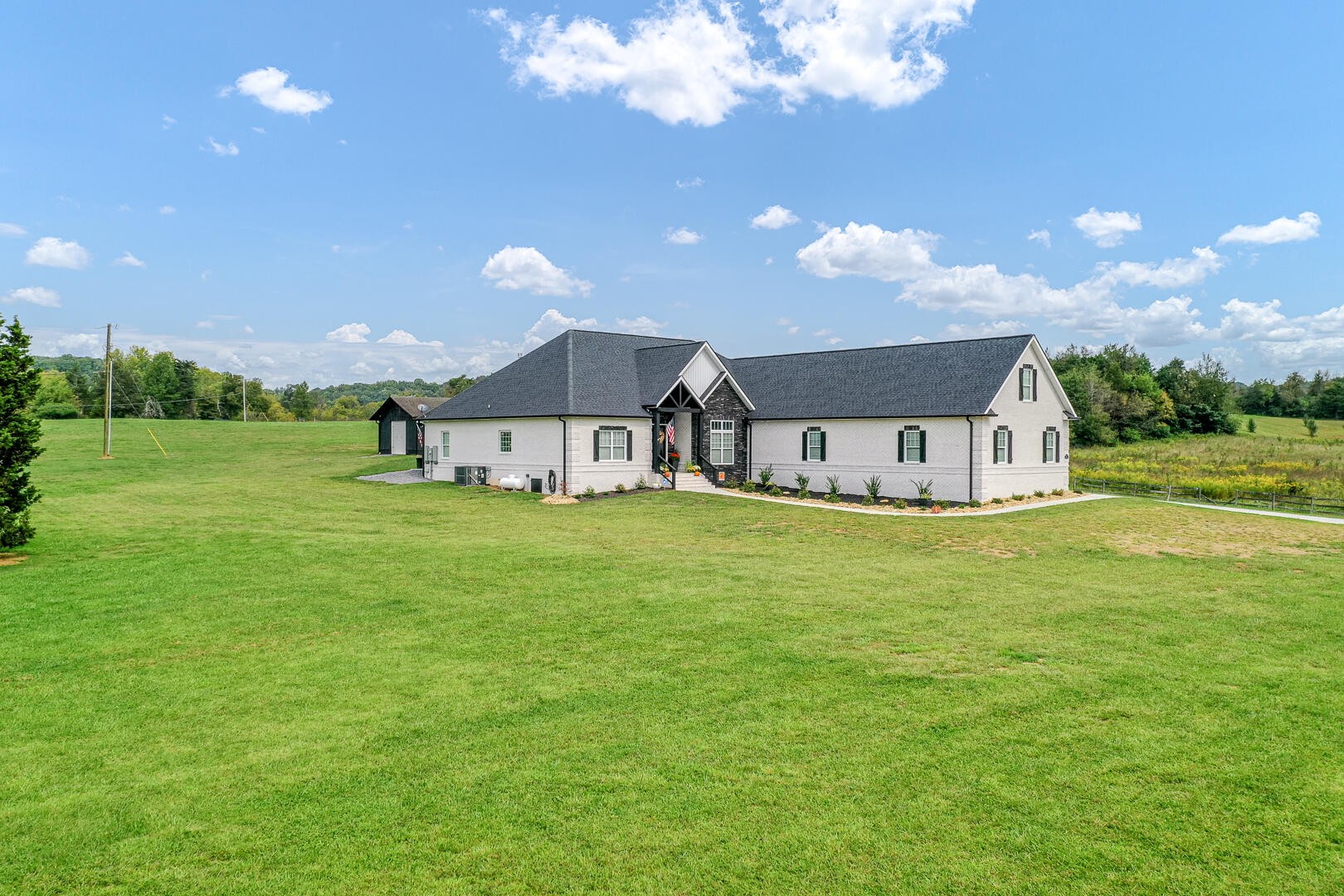 4833 Morganton Road Greenback, TN 37742 - Photo 5 of 40 a house view with a garden space