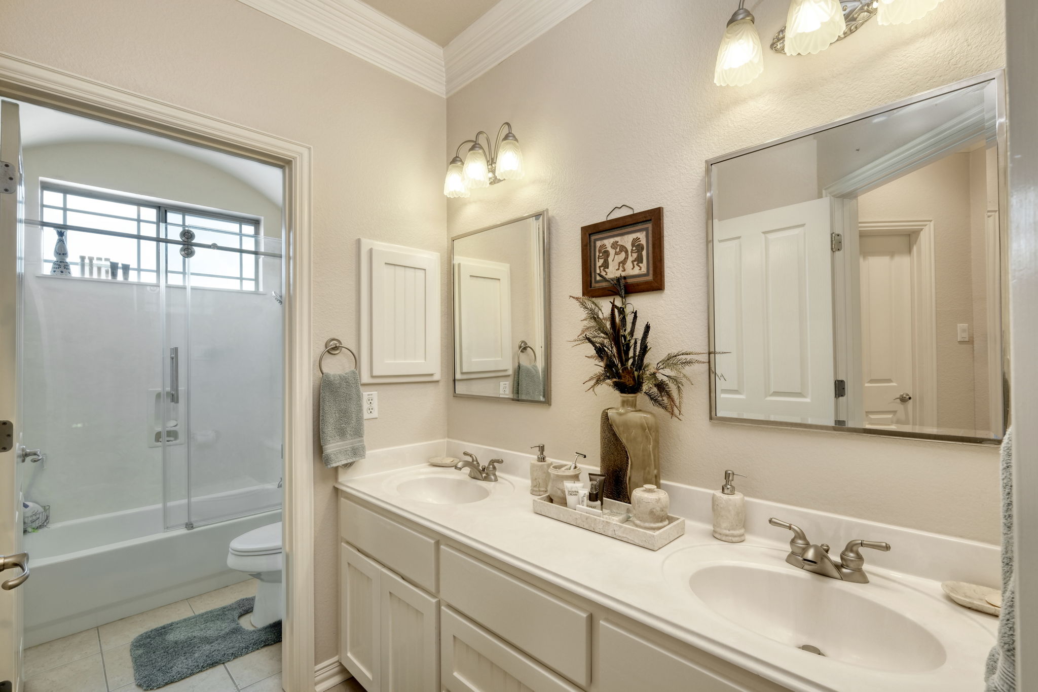 1601 Coronado Leander, TX 78641 - Photo 23 of 37 a bathroom with a sink double vanity granite tub and a mirror