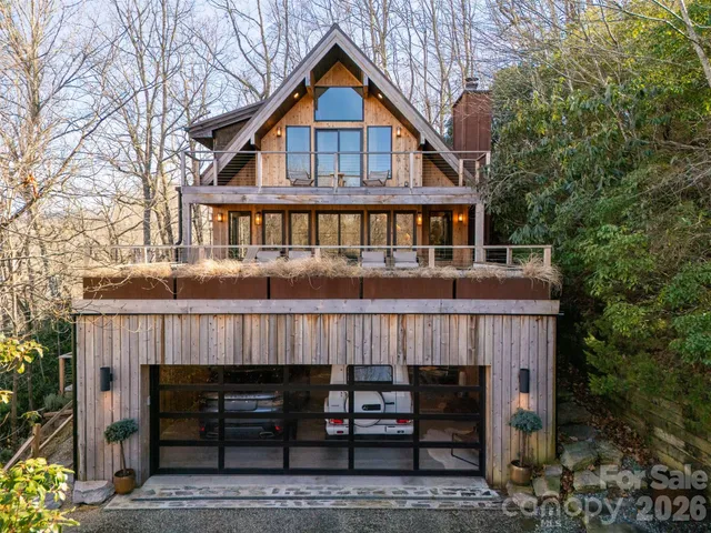 a front view of a house with a deck
