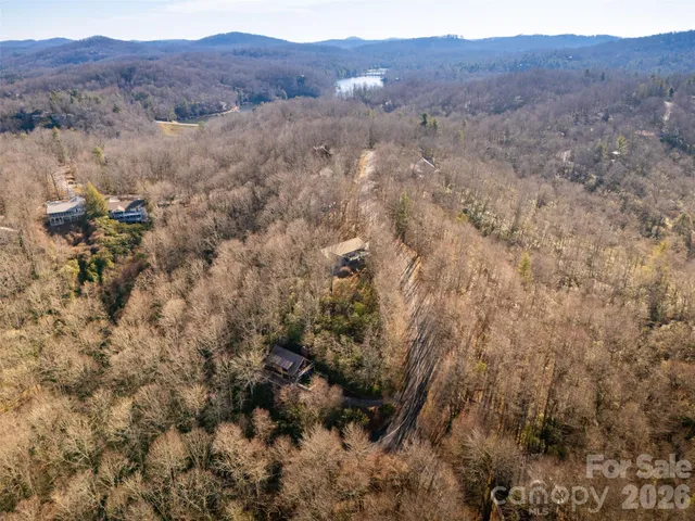 a backyard of a house with lots of trees